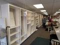 Empty shelves in back room of Bargains